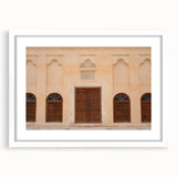 Abstract art print of Dubai skyline in muted gray and blue tones on a framed white mat.