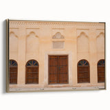 Framed canvas featuring a vintage-style landscape painting of Dubai, with muted gold and black tones.