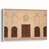 Vintage poster art of Dubai skyline in colorful hues on a framed canvas, ideal for living room decor.