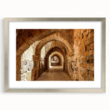 Textured art print of abstract Middle Eastern scenery in muted earth tones, framed in silver, ideal for bedroom decor.