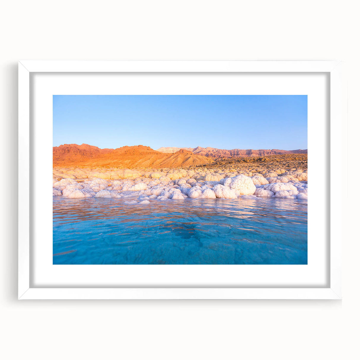Abstract art print of a Jordanian landscape, featuring earthy tones on a white matted frame, suitable for dining room decor.