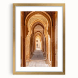 Abstract textured art print depicting a Middle Eastern scenery in muted gold and beige tones, framed with mat.