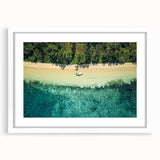 Abstract art print of oceanic scenery in muted blue and white tones, framed with a white mat.