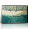 Large abstract wall art depicting serene Oceania Fiji scenery in muted blue and green tones, framed in black acrylic.