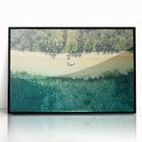 Large abstract wall art depicting serene Oceania Fiji scenery in muted blue and green tones, framed in black acrylic.