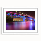 Abstract art print of Auckland skyline in muted blue and gray tones on a framed canvas, ideal for dining room decor.