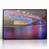 Framed acrylic print of large abstract wall art featuring Auckland's skyline in muted gray and blue tones.