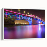 Vintage poster art of Auckland skyline in vibrant colors on a framed canvas, ideal for living room decor.