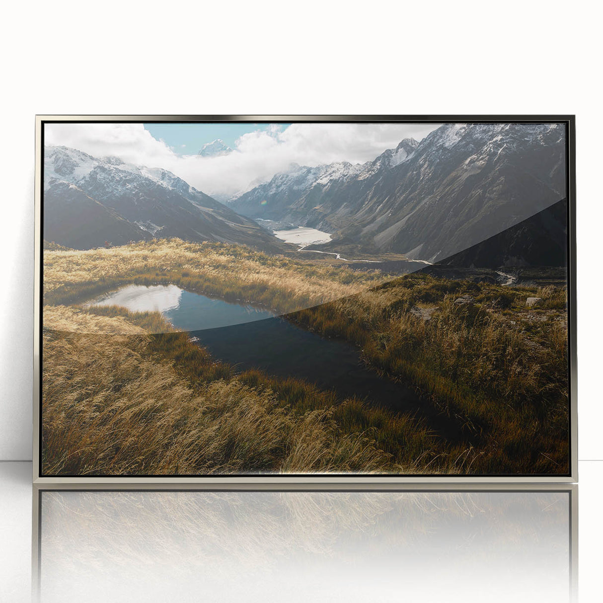 Mid-century modernist art of New Zealand's Canterbury region in silver-framed acrylic, featuring subdued earth tones.