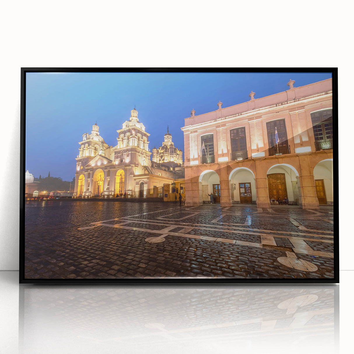 Large abstract wall art depicting a stylized scene of South America in muted earth tones, framed in black acrylic.