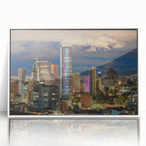 Acrylic print of a scenic Colombian landscape in muted greens and blues, framed in white.