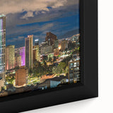 Framed canvas featuring a textured depiction of a Colombian landscape in black with vibrant color accents.