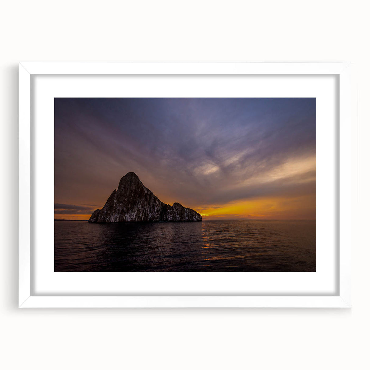 Abstract art print of Galapagos scenery in muted earth tones on a white framed canvas.