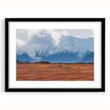 Colorful abstract art print of Denali, Alaska in vibrant hues on a large framed canvas, ideal for living room decor.