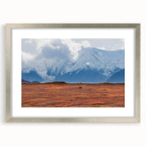 Textured abstract art print of Denali, Alaska, in muted earth tones on a framed canvas, suitable for bedroom decor.