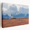 Large stretched canvas featuring a realistic depiction of Denali National Park in Alaska, with subdued earth tones.
