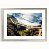 Textured abstract art print of California's Big Sur in muted earth tones on a framed silver mat, ideal for bedroom art.