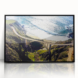 Large abstract wall art depicting the Big Sur coastline in muted gray and blue tones, framed in black acrylic.