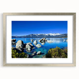 Textured art print depicting an abstract view of Lake Tahoe in muted blue and green tones on a framed silver matte canvas.