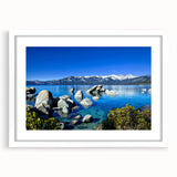 Abstract art print of Lake Tahoe in muted blue and green tones, framed with a white mat.