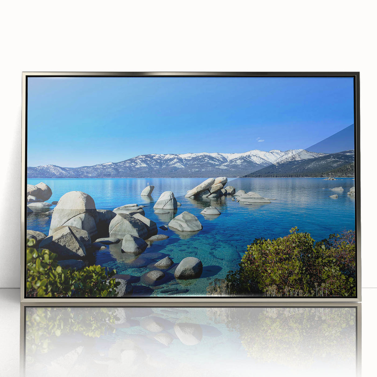 Mid-century modernist art depicting Lake Tahoe in acrylic, framed in silver, with vibrant blue and green tones.