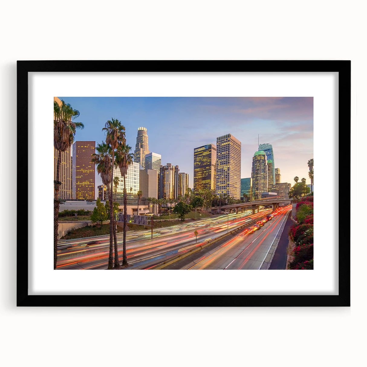 Extra large abstract art print of Los Angeles skyline in vibrant colors on a textured canvas, framed in black.