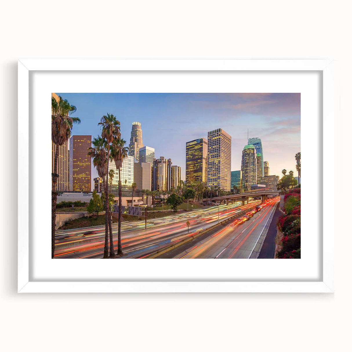 Abstract art print of Los Angeles skyline in muted blue and gray tones on a white framed canvas.