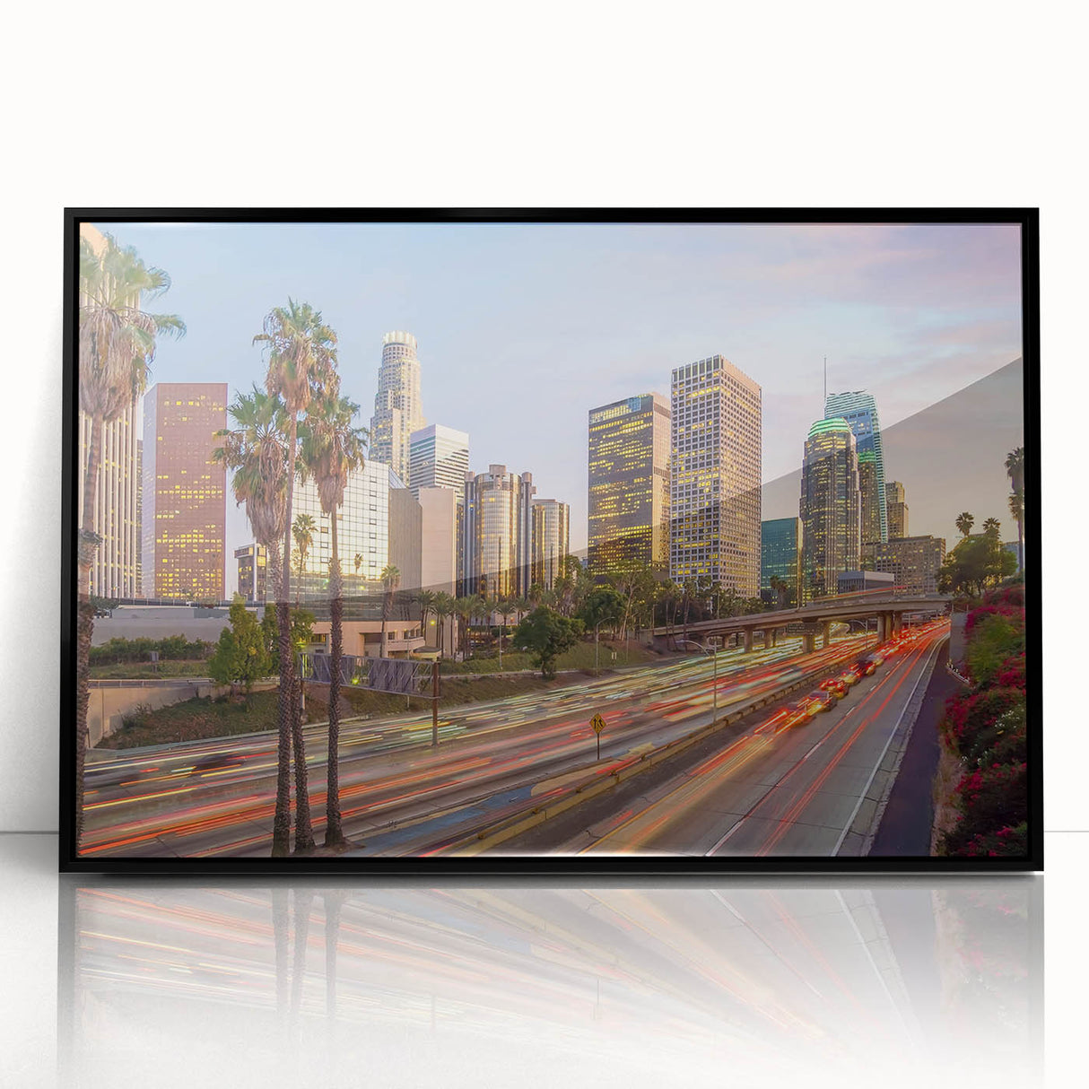 Large abstract wall art featuring a minimalist Los Angeles skyline in muted gray tones on a black framed acrylic print.