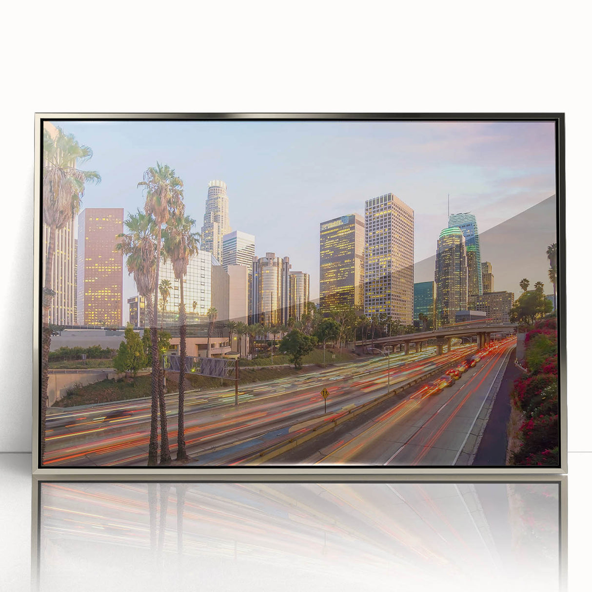 Mid-century modernist art of the Los Angeles skyline in muted tones on a silver-framed acrylic print.