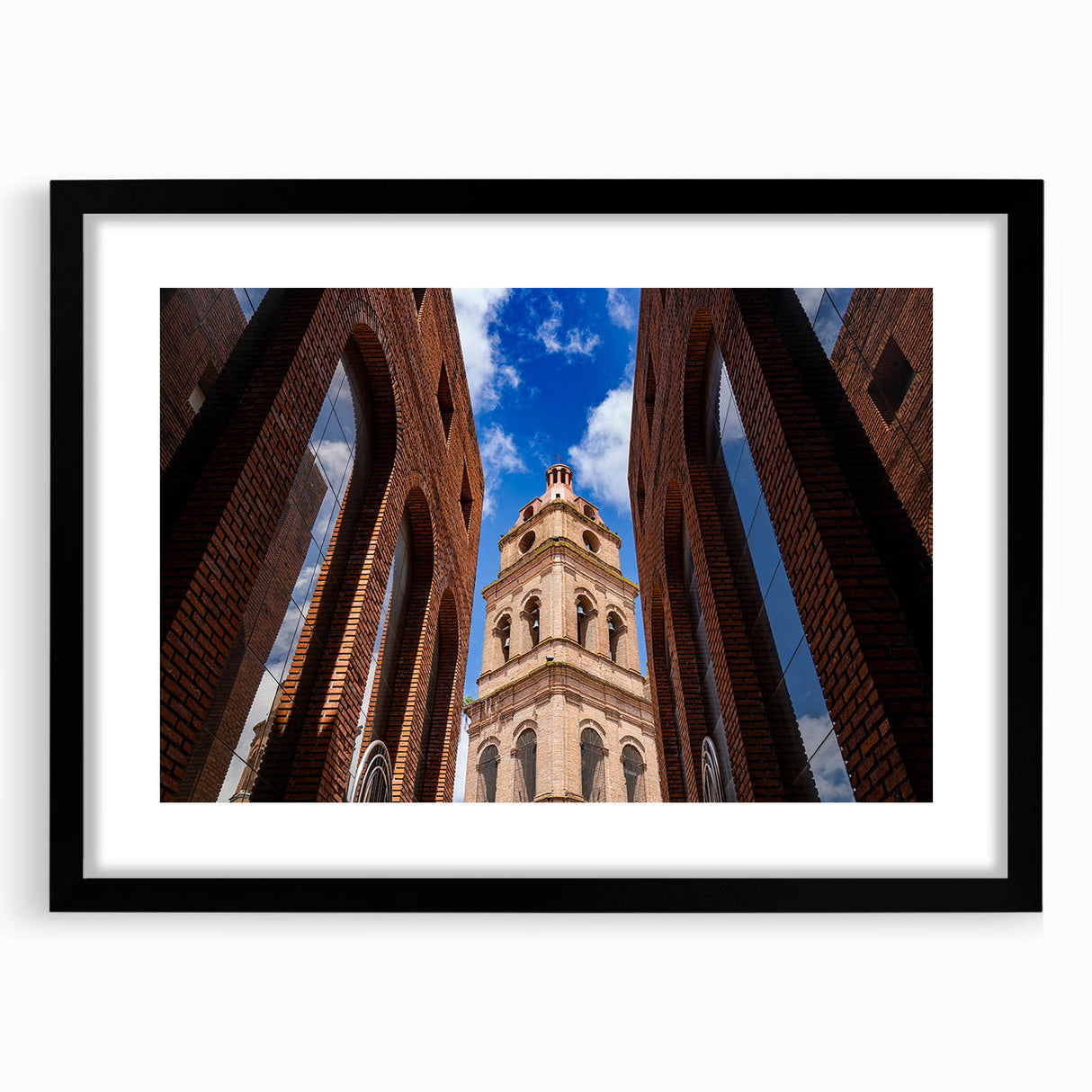 Abstract art print depicting a textured, colorful scenery of Santa Cruz, in a black frame with mat.