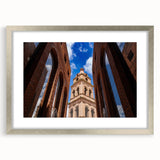 Textured abstract art print of Santa Cruz in muted earth tones on a framed silver mat, suitable for bedroom decor.