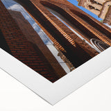 Art deco poster of Santa Cruz with muted blue and peach tones on rolled canvas, suitable for dining room wall art.