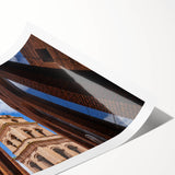 Extra large wall art featuring line art flowers in muted earth tones on a rolled canvas.