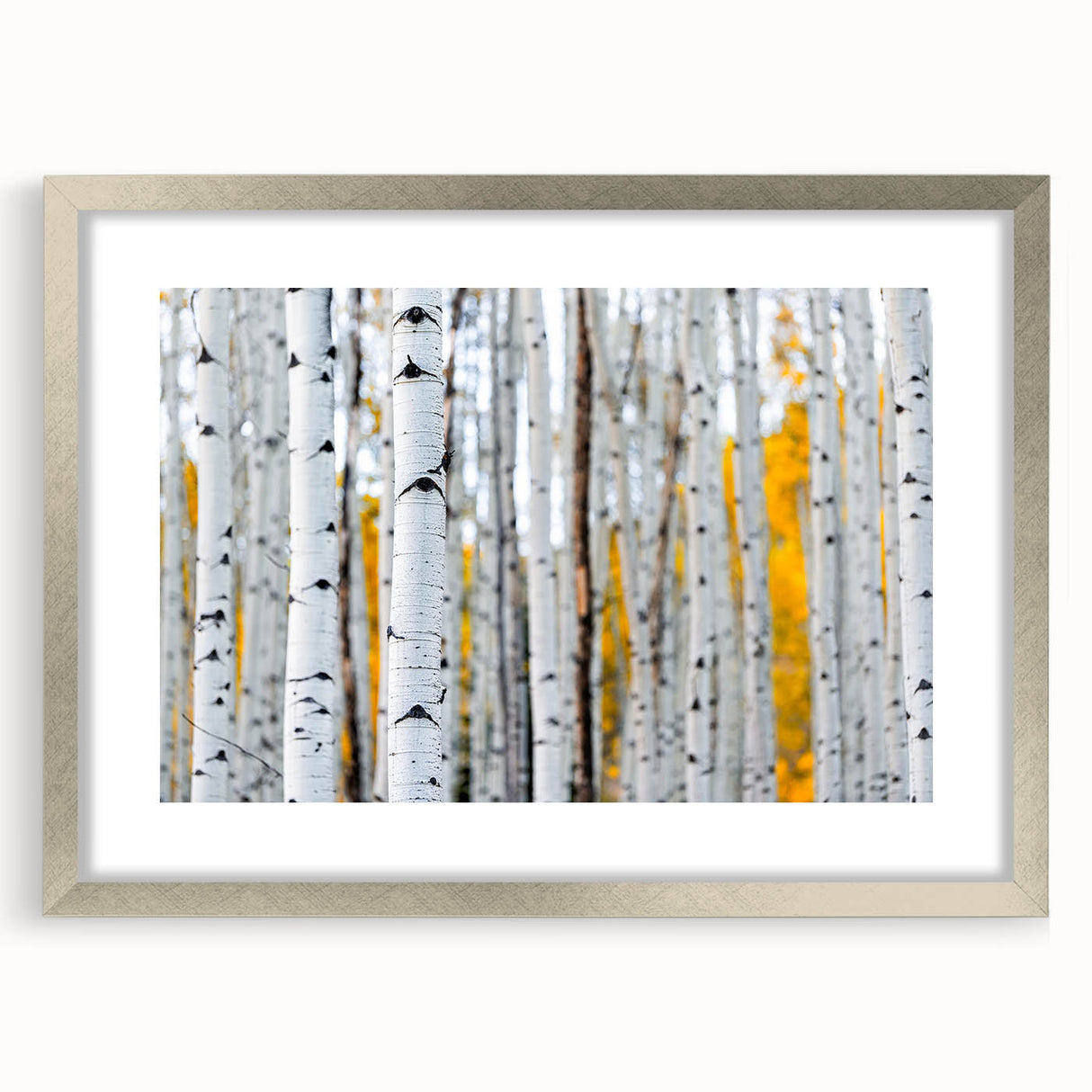 Textured art print of abstract Aspen, Colorado scenery in muted earth tones, framed in silver, ideal for bedroom decor.