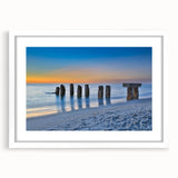 Abstract art print of Florida Keys in muted blue and green tones on a framed white mat.
