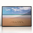Large abstract wall art depicting a serene Kauai landscape in muted green and blue tones, framed in black acrylic.