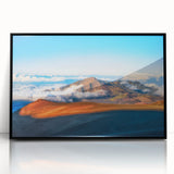 Large abstract wall art depicting Maui scenery in vibrant hues on a black-framed acrylic print.