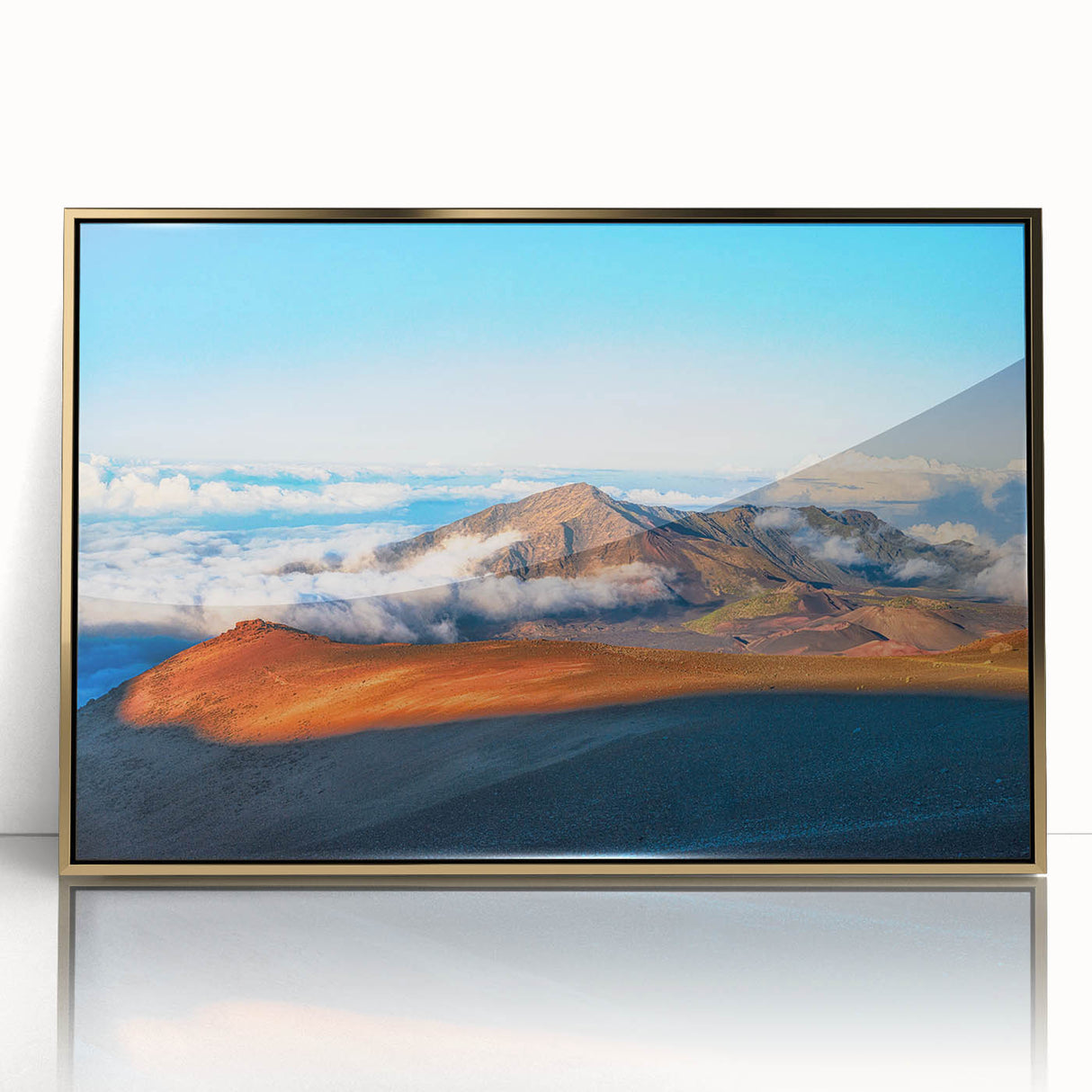 Large art print of a Maui, Hawaii landscape with lush greenery and ocean, framed in gold acrylic.