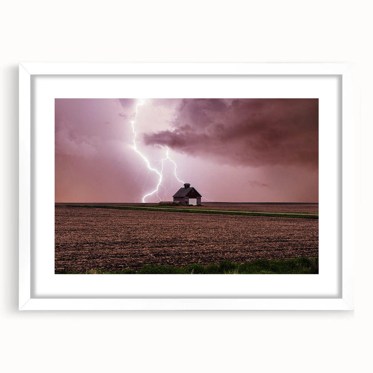 Abstract art print of Iowa scenery in muted earth tones on a framed white mat, suitable for dining room decor.