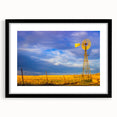 Extra large abstract art print of a colorful, textured Kansas scenery on a black framed canvas, ideal for living room decor.