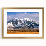 Extra large abstract art print featuring textured scenery of Montana in muted earth tones, framed in gold.