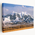 Landscape painting of Montana scenery on a large stretched canvas, featuring earthy green and blue tones.