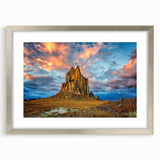 Textured abstract art print depicting a New Mexico scenery in earth tones, framed in silver, ideal for bedroom art.