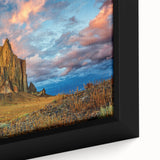 Extra large framed canvas featuring a textured depiction of a New Mexico scenery in black with colorful art accents.