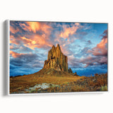 Vintage poster art of a New Mexico landscape on a framed canvas, featuring a palette of earth tones.