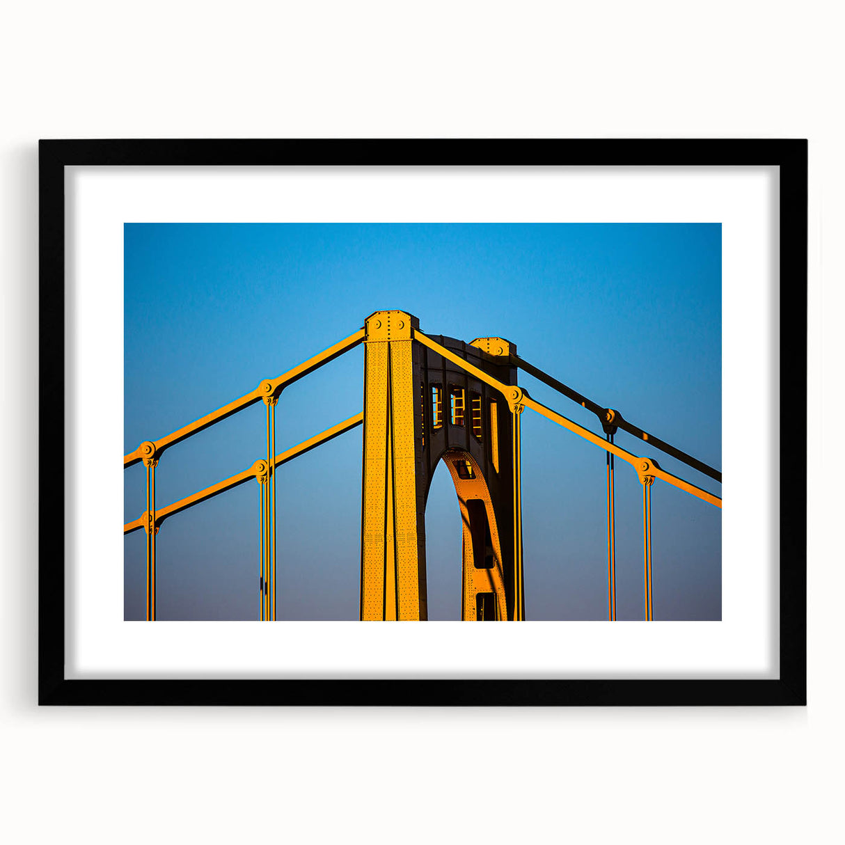 Abstract art print of Pittsburgh skyline in vibrant colors on a large framed canvas, ideal for living room decor.