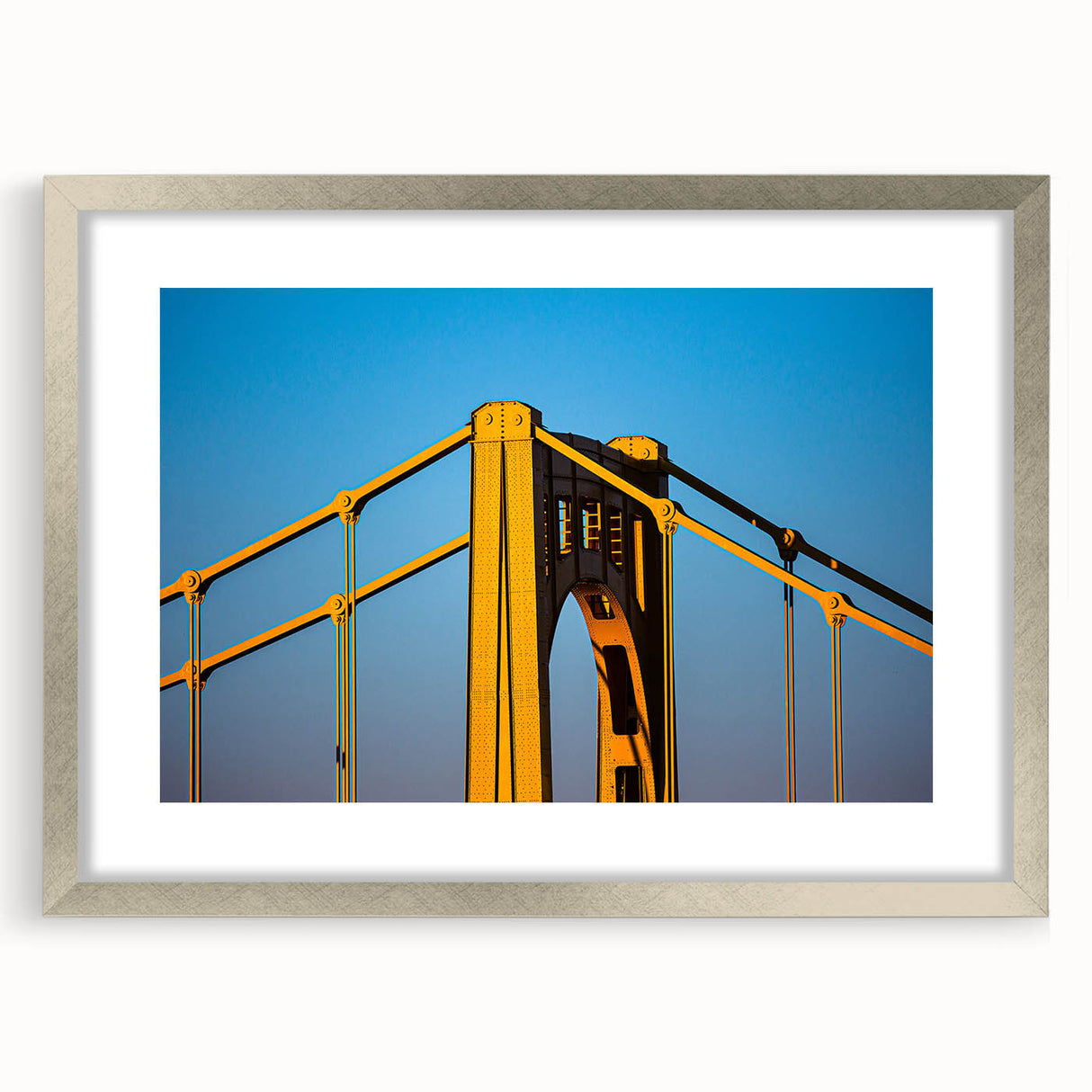 Textured abstract art print of Pittsburgh skyline in muted gray and blue tones on a framed silver mat, ideal for bedroom art.