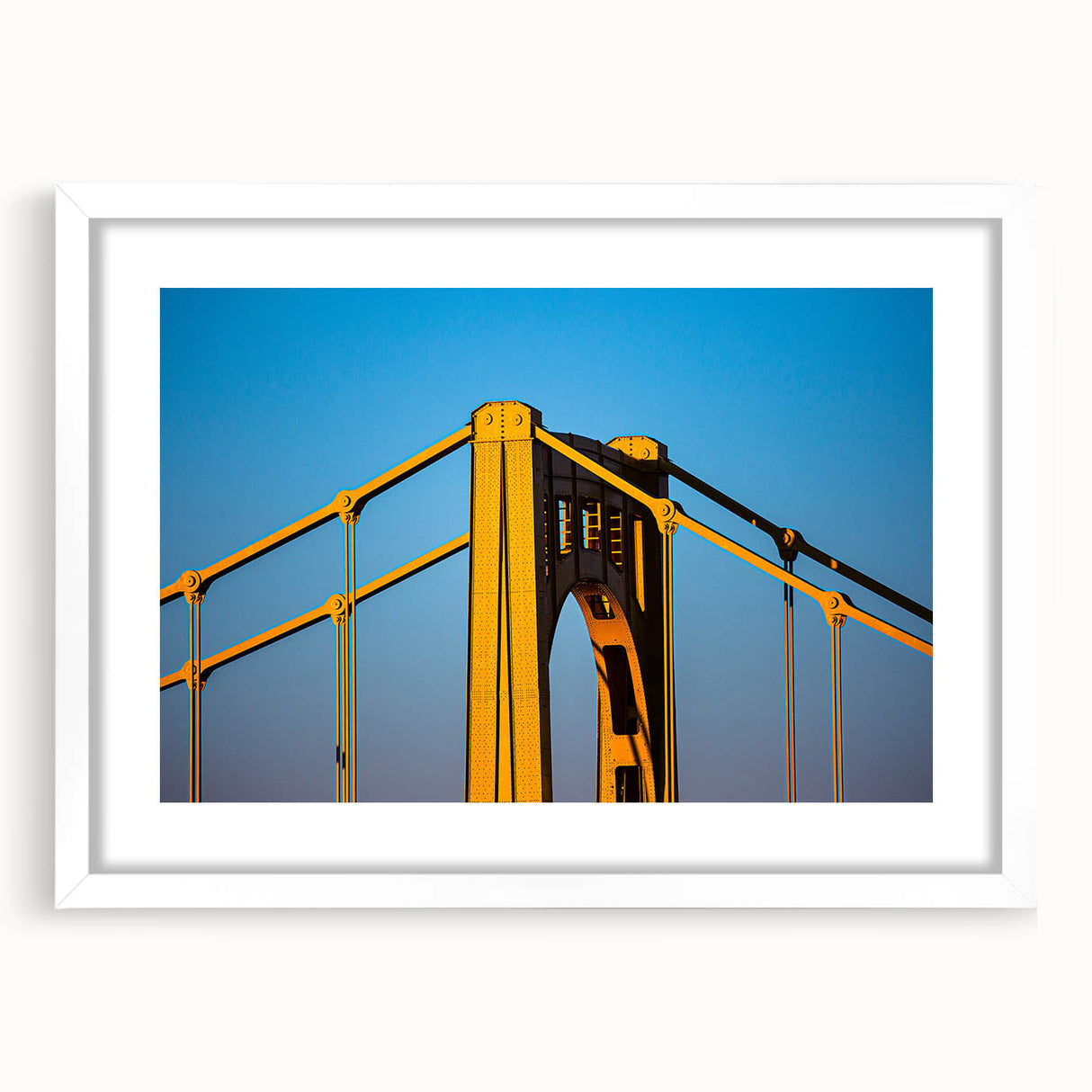 Abstract art print of Pittsburgh skyline in muted gray and blue tones on a framed white mat, ideal for dining room decor.