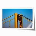 Panoramic view of Pittsburgh skyline in muted gray and blue tones on a rolled canvas, suitable for dining room wall art.