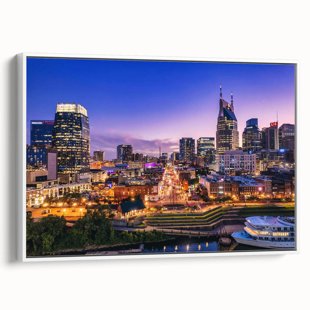 Vintage poster art of Nashville skyline in colorful tones on a large framed canvas, suitable for living room decor.